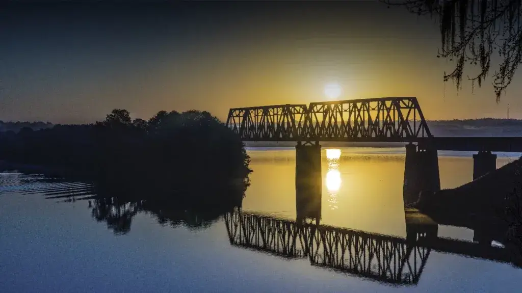 Old bridge over Lake Eufaula at Sunset