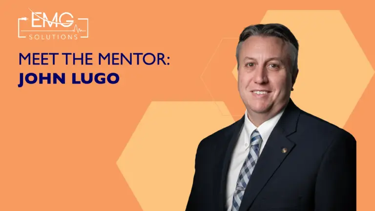 A professional headshot of John Lugo in a dark suit and tie against an orange background. The image includes the EMG Solutions logo and the text: "MEET THE MENTOR: JOHN LUGO."